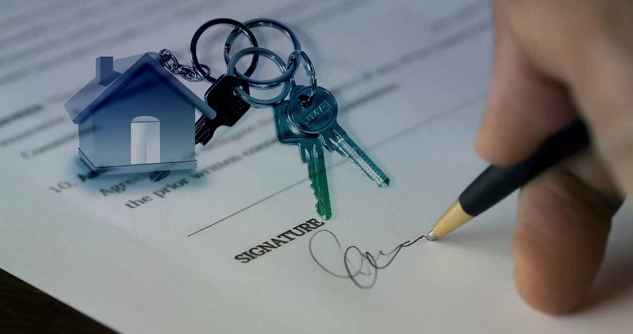 Happy homeowners shaking hands